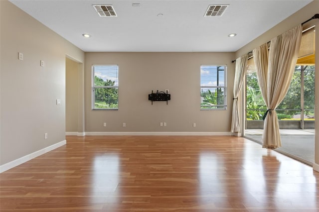 1892 Sanderling Dr, Clermont, FL 34711 - empty room with light wood finished floors and recessed lighting