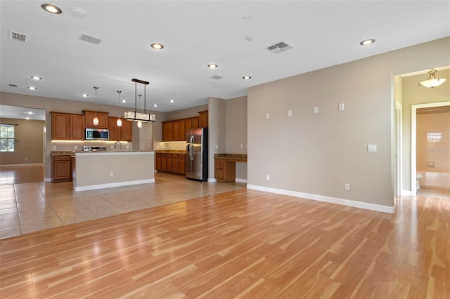 1892 Sanderling Dr, Clermont, FL 34711 - unfurnished living room featuring recessed lighting and light wood finished floors