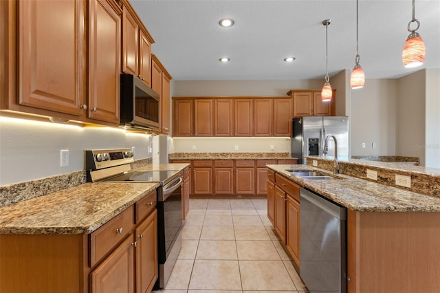1892 Sanderling Dr, Clermont, FL 34711 - kitchen with appliances with stainless steel finishes, decorative light fixtures, light stone countertops, light tile patterned floors, and brown cabinetry