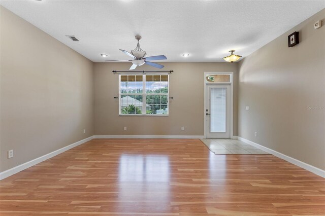 1892 Sanderling Dr, Clermont, FL 34711 - spare room with light wood finished floors and a ceiling fan
