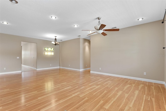1892 Sanderling Dr, Clermont, FL 34711 - empty room with ceiling fan, a chandelier, light wood-style flooring, and recessed lighting