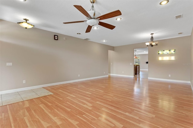 1892 Sanderling Dr, Clermont, FL 34711 - empty room with light wood-style flooring, a chandelier, ceiling fan, and recessed lighting