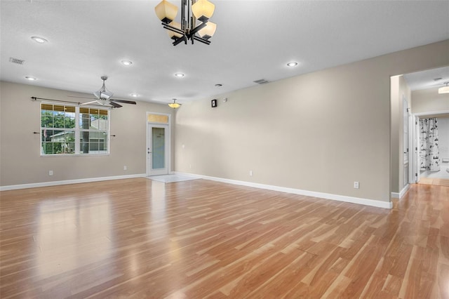 1892 Sanderling Dr, Clermont, FL 34711 - unfurnished living room featuring a chandelier, light wood-type flooring, a ceiling fan, and recessed lighting