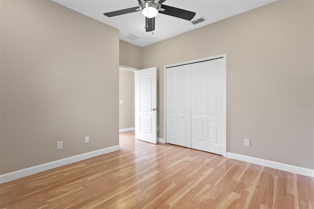 1892 Sanderling Dr, Clermont, FL 34711 - unfurnished bedroom with light wood-type flooring, a closet, and ceiling fan