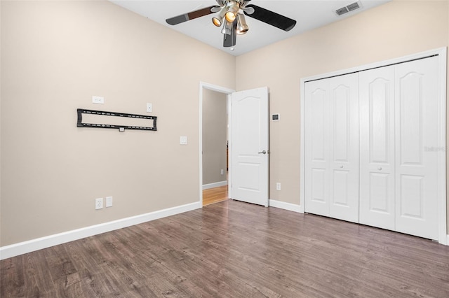 1892 Sanderling Dr, Clermont, FL 34711 - unfurnished bedroom with wood finished floors, a closet, and ceiling fan