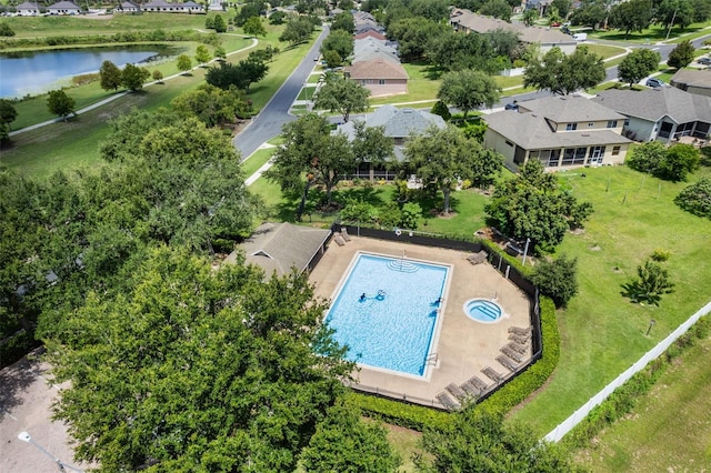 1892 Sanderling Dr, Clermont, FL 34711 - aerial perspective of suburban area featuring a pool area and a nearby body of water