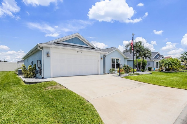 5778 Henry Loop, The Villages, FL 32163 - ranch-style home featuring concrete driveway, a garage, a front yard, and stucco siding