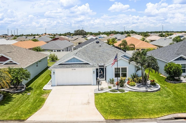 5778 Henry Loop, The Villages, FL 32163 - single story home featuring a residential view, driveway, a front lawn, an attached garage, and stucco siding