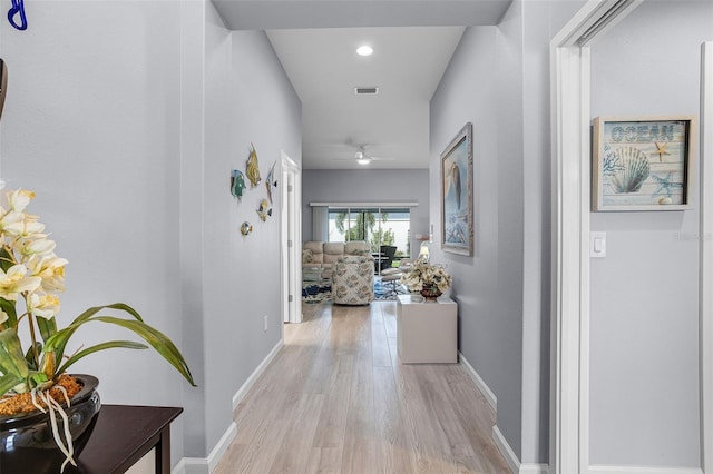 5778 Henry Loop, The Villages, FL 32163 - hall with light wood finished floors and baseboards