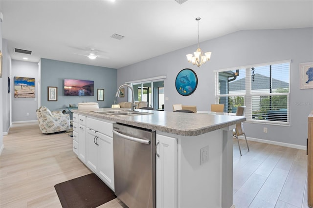 5778 Henry Loop, The Villages, FL 32163 - kitchen with dishwasher, light wood-style floors, white cabinetry, pendant lighting, and light countertops