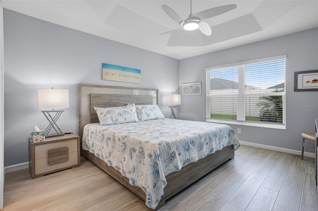 5778 Henry Loop, The Villages, FL 32163 - bedroom with wood finished floors and a ceiling fan