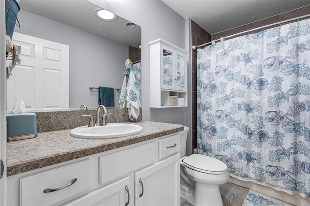5778 Henry Loop, The Villages, FL 32163 - bathroom with vanity, a textured ceiling, and curtained shower