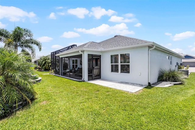 5778 Henry Loop, The Villages, FL 32163 - rear view of property with a lawn, stucco siding, a sunroom, roof with shingles, and a patio
