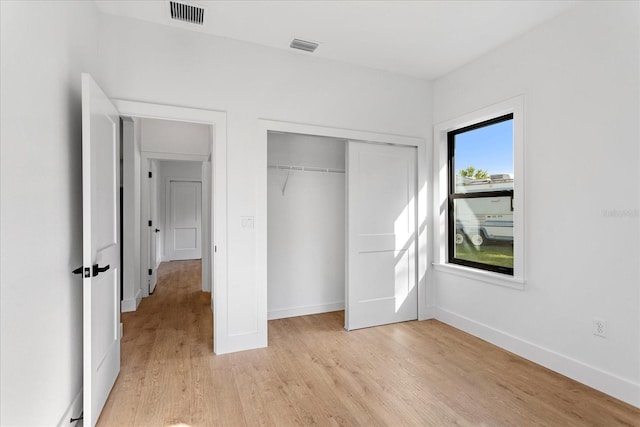 16615 Oklahoma St, Clermont, FL 34715 - unfurnished bedroom featuring light wood-style floors and a closet
