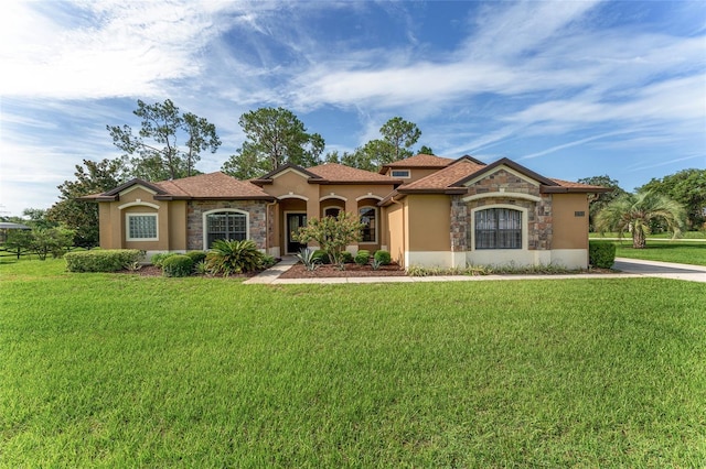 21312 Marsh View Ct, Clermont, FL 34715 - mediterranean / spanish home with stone siding, stucco siding, and a front yard