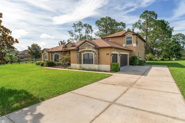 21312 Marsh View Ct, Clermont, FL 34715 - mediterranean / spanish house featuring stone siding, stucco siding, concrete driveway, and an attached garage