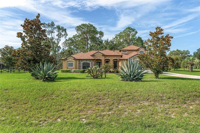 21312 Marsh View Ct, Clermont, FL 34715 - mediterranean / spanish-style house with stucco siding and a front yard