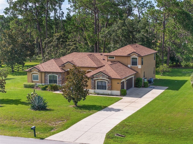 21312 Marsh View Ct, Clermont, FL 34715 - mediterranean / spanish home with stone siding, a front yard, stucco siding, and concrete driveway