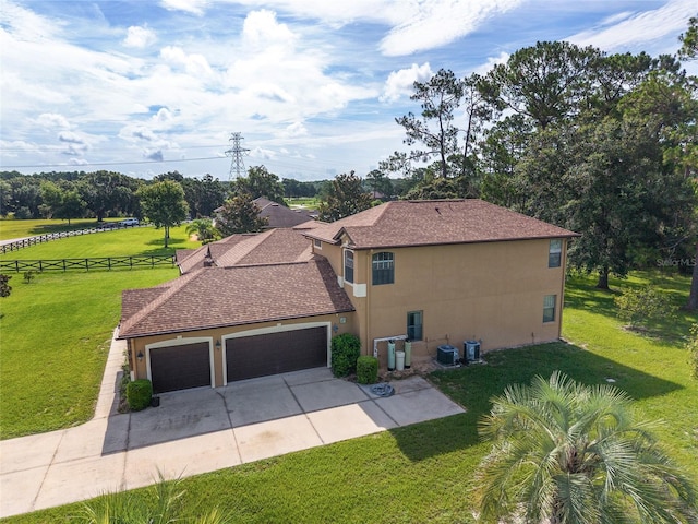 21312 Marsh View Ct, Clermont, FL 34715 - view of side of home featuring a garage, stucco siding, and driveway