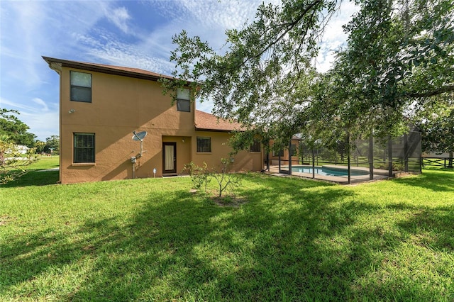 21312 Marsh View Ct, Clermont, FL 34715 - back of house with stucco siding, a lawn, and an outdoor pool