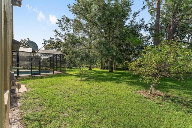 21312 Marsh View Ct, Clermont, FL 34715 - view of grassy yard featuring an outdoor pool and a lanai