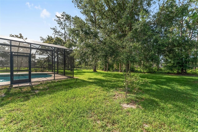 21312 Marsh View Ct, Clermont, FL 34715 - view of grassy yard with an outdoor pool and a lanai