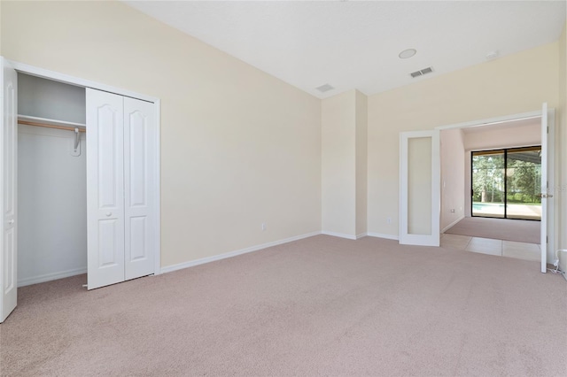 21312 Marsh View Ct, Clermont, FL 34715 - unfurnished bedroom with carpet floors and a closet