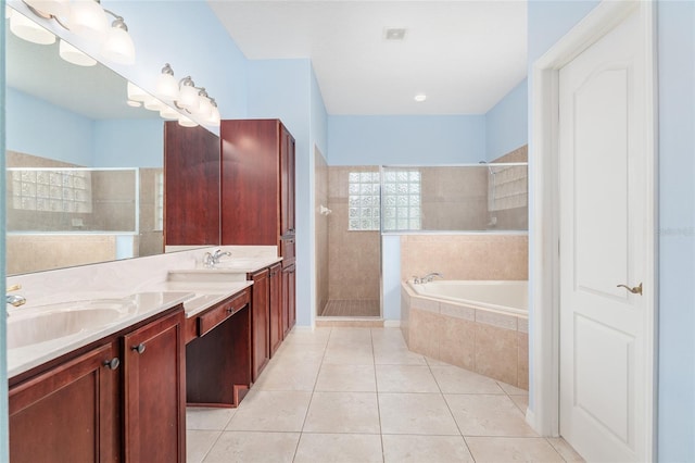 21312 Marsh View Ct, Clermont, FL 34715 - bathroom with walk in shower, double vanity, tile patterned floors, and a garden tub
