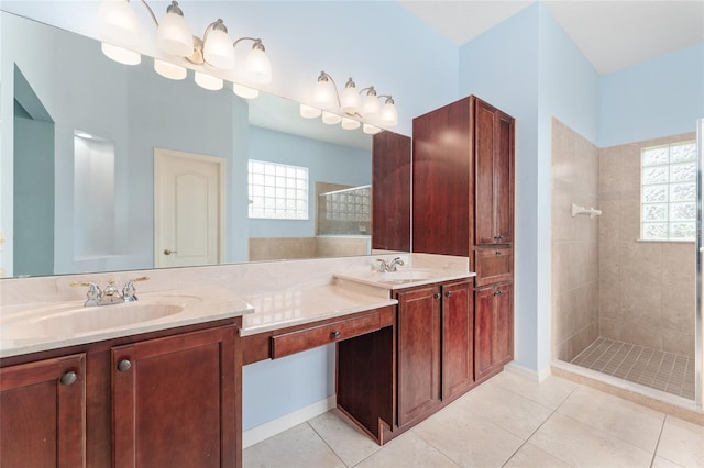 21312 Marsh View Ct, Clermont, FL 34715 - bathroom with double vanity, tiled shower, healthy amount of natural light, and tile patterned floors