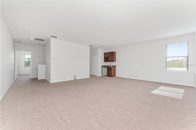 21312 Marsh View Ct, Clermont, FL 34715 - unfurnished living room with light colored carpet