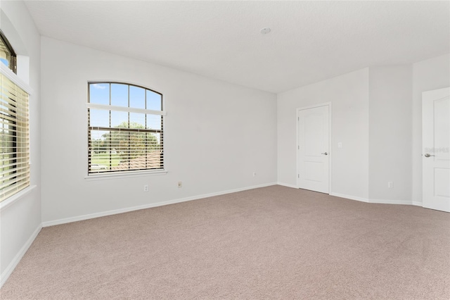 21312 Marsh View Ct, Clermont, FL 34715 - spare room featuring carpet flooring and baseboards