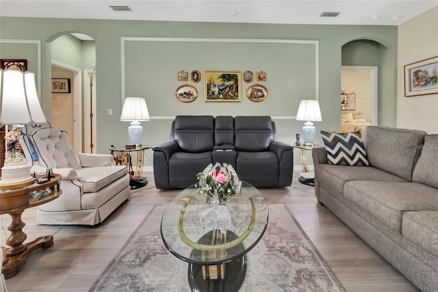3507 Arlington Ridge Blvd, Leesburg, FL 34748 - living room featuring arched walkways and wood finished floors