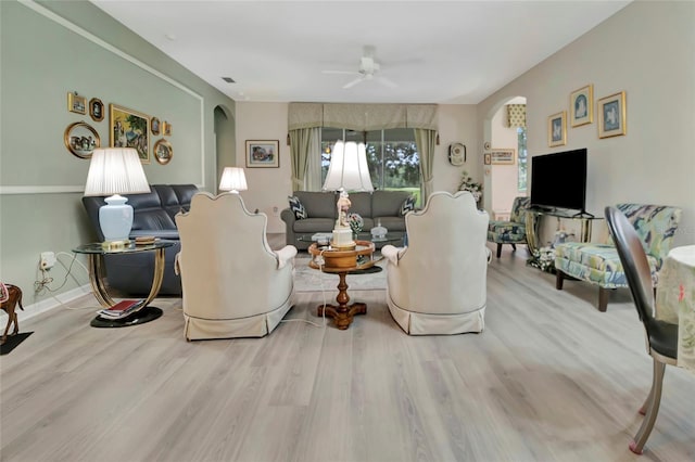 3507 Arlington Ridge Blvd, Leesburg, FL 34748 - living area with arched walkways, wood finished floors, and a ceiling fan