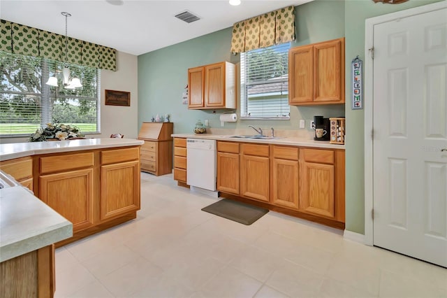 3507 Arlington Ridge Blvd, Leesburg, FL 34748 - kitchen with dishwasher, light countertops, healthy amount of natural light, and decorative light fixtures