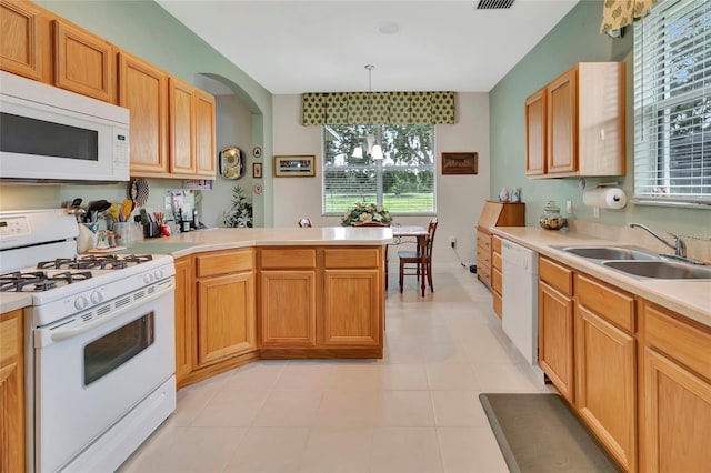 3507 Arlington Ridge Blvd, Leesburg, FL 34748 - kitchen with white appliances, light countertops, and a peninsula