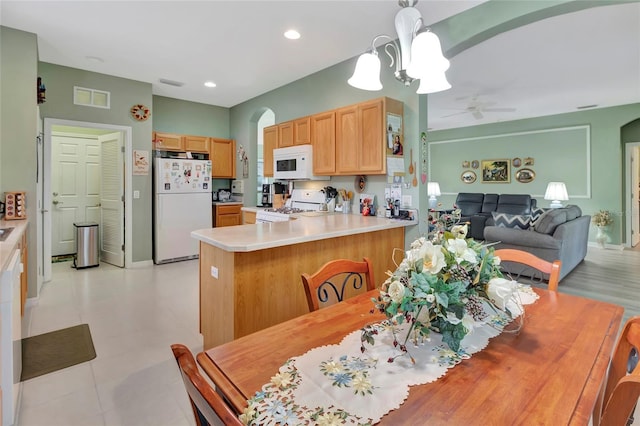 3507 Arlington Ridge Blvd, Leesburg, FL 34748 - dining space with arched walkways, ceiling fan, and recessed lighting