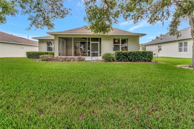 3507 Arlington Ridge Blvd, Leesburg, FL 34748 - rear view of property with a lawn, stucco siding, a sunroom, and ceiling fan