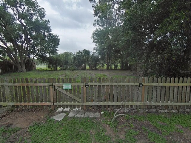 1610 Williams Ave, Eustis, FL 32726 - view of yard featuring a gate
