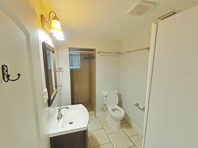 1610 Williams Ave, Eustis, FL 32726 - bathroom featuring a tile shower, tile patterned flooring, and vanity