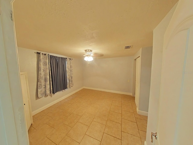 1610 Williams Ave, Eustis, FL 32726 - spare room featuring a textured ceiling, ceiling fan, and light tile patterned floors