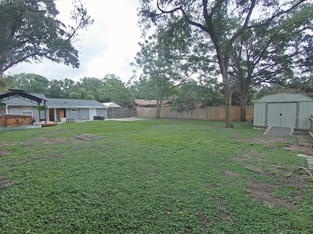 1610 Williams Ave, Eustis, FL 32726 - fenced backyard featuring a storage shed