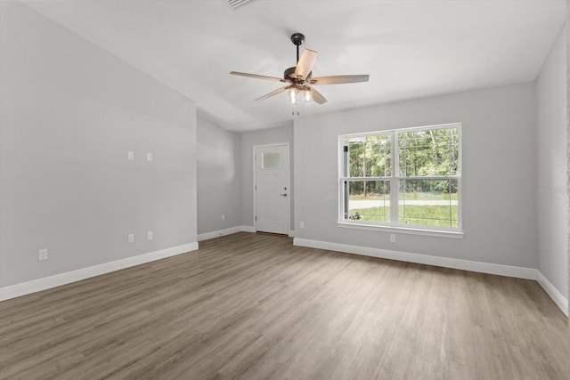 8641 N Stern Way, Citrus Springs, FL 34434 - empty room with wood finished floors and a ceiling fan