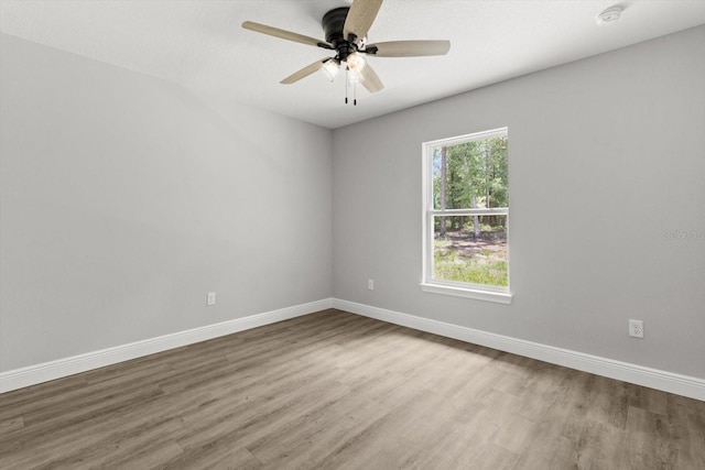 8641 N Stern Way, Citrus Springs, FL 34434 - spare room with wood finished floors, a ceiling fan, and a smoke detector
