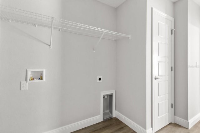 8641 N Stern Way, Citrus Springs, FL 34434 - laundry room featuring electric dryer hookup, hookup for a washing machine, and wood finished floors
