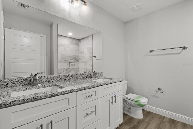 8641 N Stern Way, Citrus Springs, FL 34434 - bathroom with double vanity, wood finished floors, and a tile shower