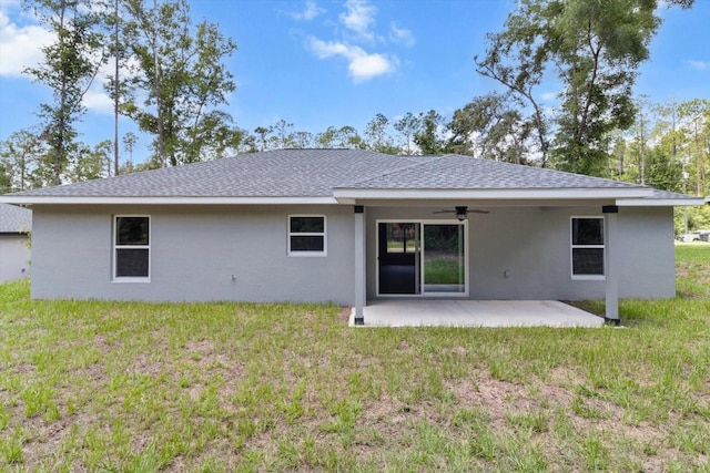 8641 N Stern Way, Citrus Springs, FL 34434 - back of property with a ceiling fan, stucco siding, a lawn, and a patio
