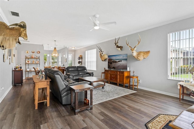 5971 Brittania Blvd, Tavares, FL 32778 - living area featuring crown molding, dark wood finished floors, and ceiling fan
