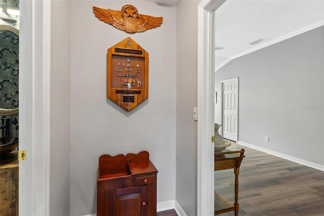 5971 Brittania Blvd, Tavares, FL 32778 - hall with dark wood-type flooring and crown molding