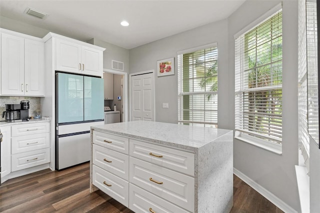 5971 Brittania Blvd, Tavares, FL 32778 - kitchen featuring white refrigerator, washer / clothes dryer, healthy amount of natural light, dark wood finished floors, and recessed lighting