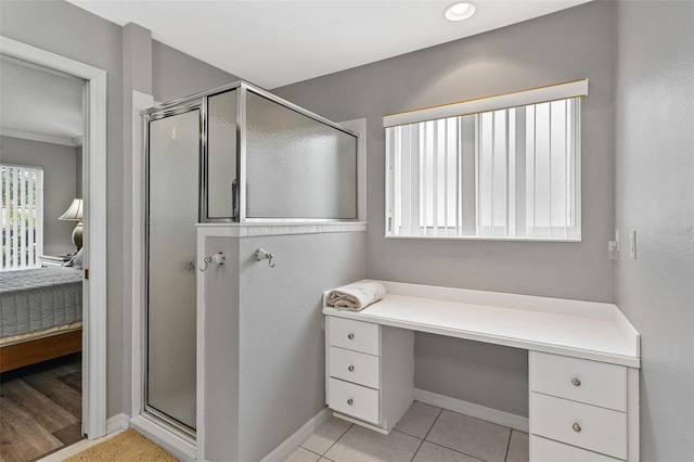 5971 Brittania Blvd, Tavares, FL 32778 - ensuite bathroom with a shower stall, crown molding, and tile patterned flooring